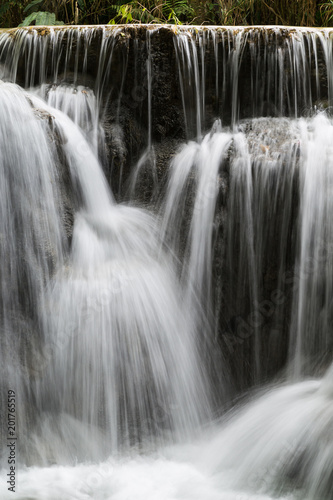 Full frame close-up of a cascade at the Tat Kuang Si Waterfalls near Luang Prabang in Laos. Natural abstract art.
