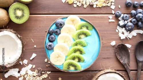 stop motion, making blue majik superfod smoothie bowl above view, flatlay photo