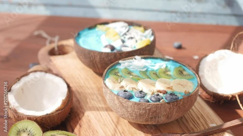 blue majik, spirulina superfood smoothie coconut bowls in windy shade photo