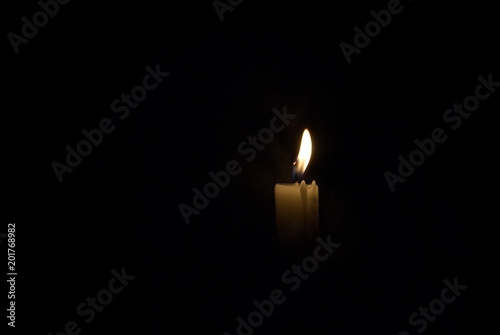 Candle in the dark. Smoke from a candle.