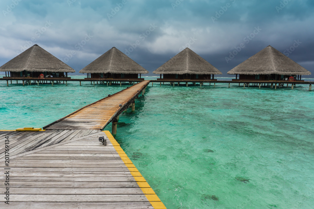 Over the water bungalows on exotic island