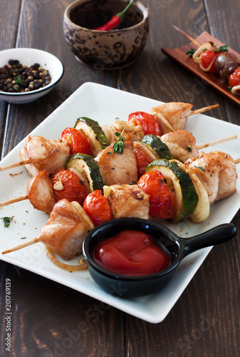Grilled chicken , cherry tomatoes, onions and zucchini skewers