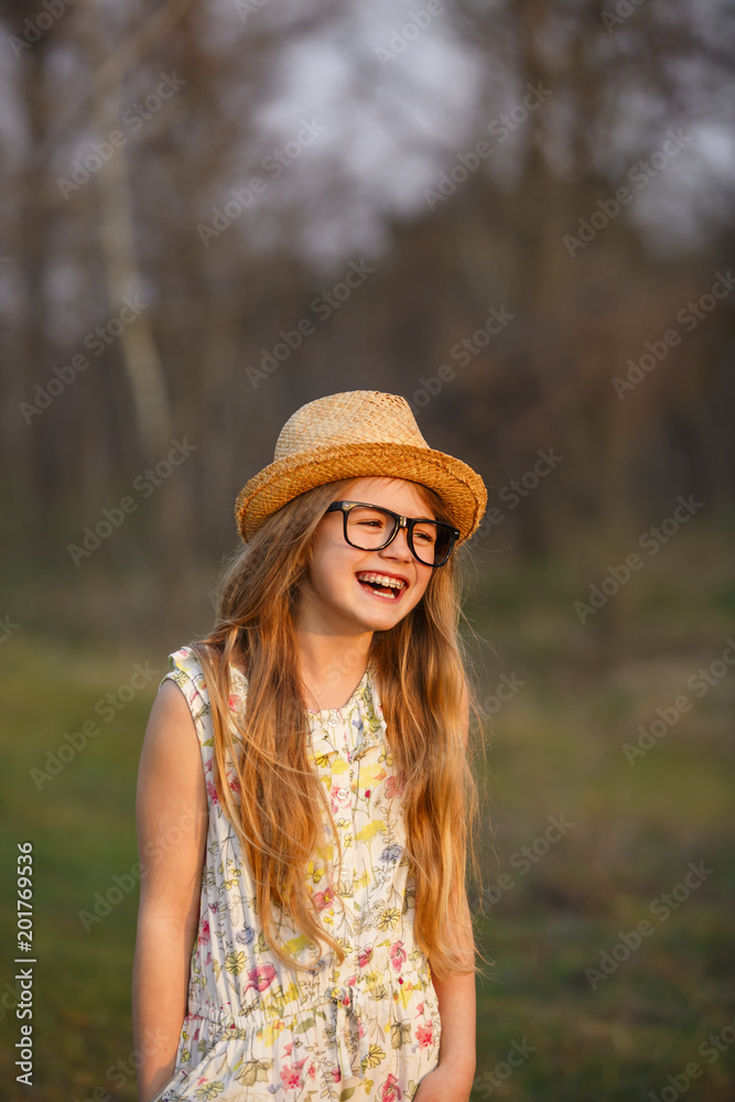 Portrait happy summer mood of joyful young girl in glasses, braces and straw hat, having fun.expressing positivity, joy, happiness, smiling