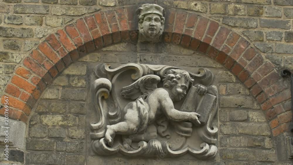 Zoom out of an angel bas-relief sculpture Zoom out of an angel bas-relief sculpture