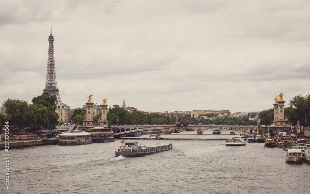View of Eiffel tower, Pont Alexandre III and Seine river in Paris, France