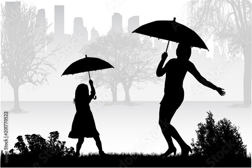 Silhouettes under the umbrella.