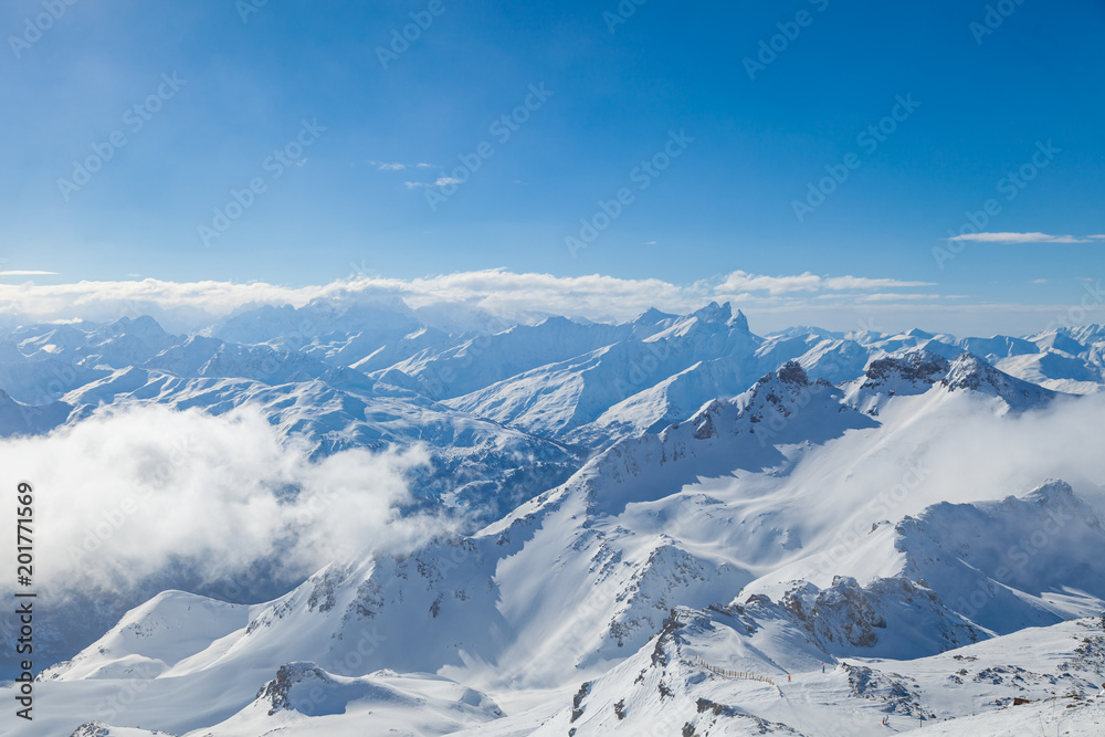 Winter Alps landscape, mountains with clouds, from ski resort Val Thorens. 3 valleys (Les Trois Vallees), France