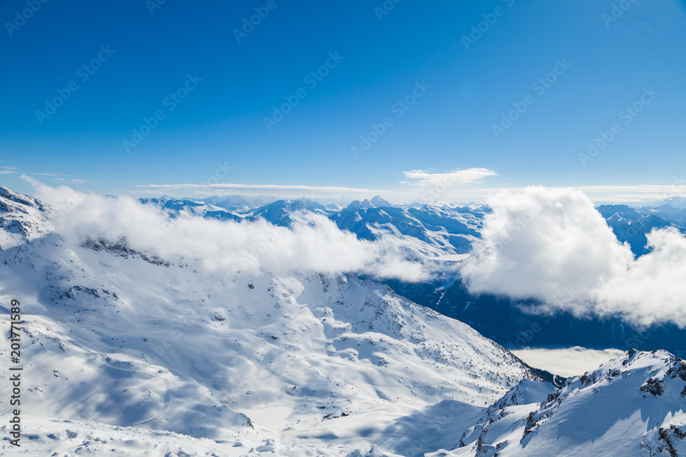 Winter Alps landscape, mountains with clouds, from ski resort Val Thorens. 3 valleys (Les Trois Vallees), France Winter Alps landscape, mountains with clouds, from ski resort Val Thorens. 3 valleys (Les Trois Vallees), France