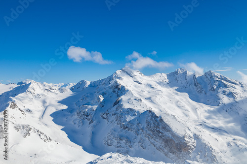 Winter Alps landscape  mountains with clouds  from ski resort Val Thorens. 3 valleys  Les Trois Vallees   France