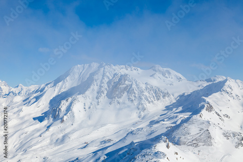 Winter Alps landscape, mountains with clouds, from ski resort Val Thorens. 3 valleys (Les Trois Vallees), France