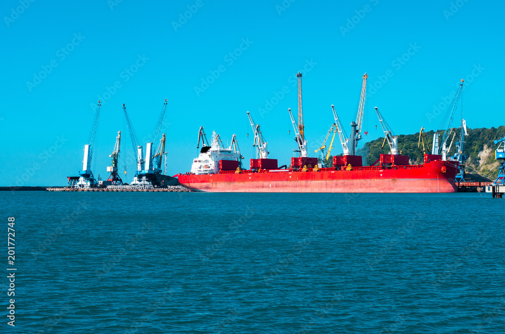 Big red ship on a shipyard background Big red ship on a shipyard background