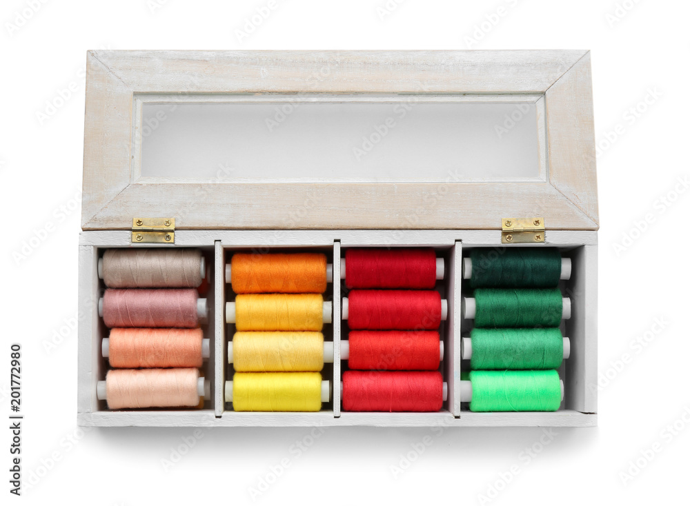 Container with set of color sewing threads on white background Container with set of color sewing threads on white background