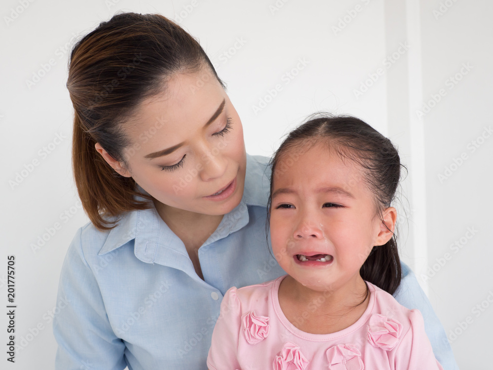 pretty mother soothing and hugging crying baby girl pretty mother soothing and hugging crying baby girl