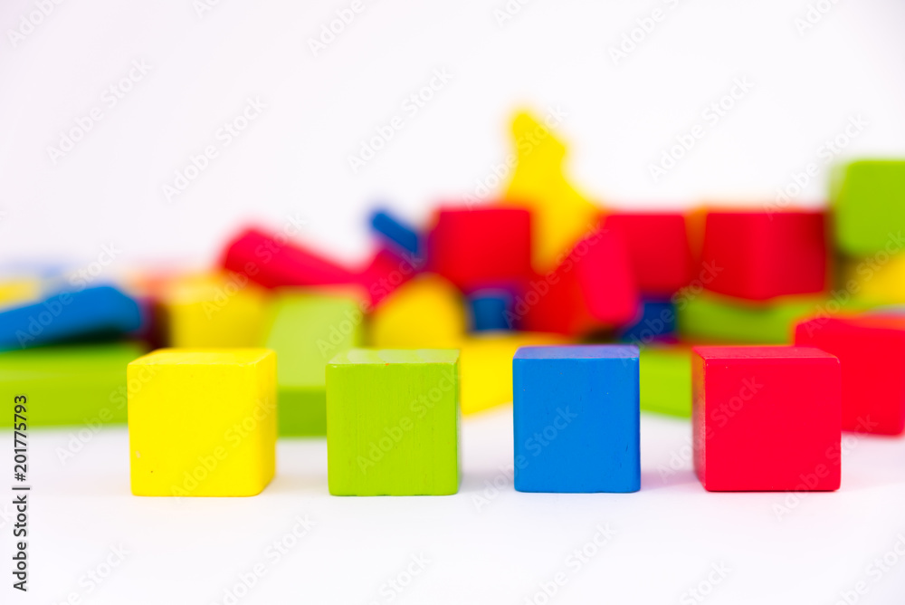 Colorful wooden building toy blocks isolated on a white background Colorful wooden building toy blocks isolated on a white background