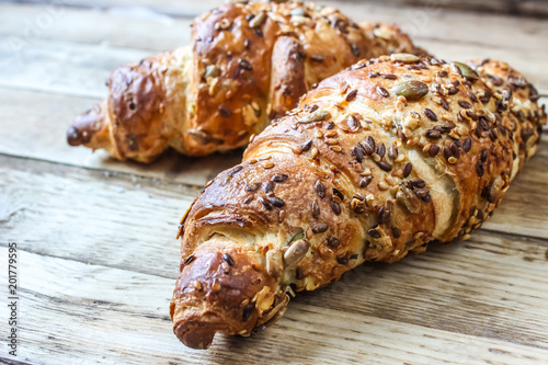 Two croissants with sesame seeds
