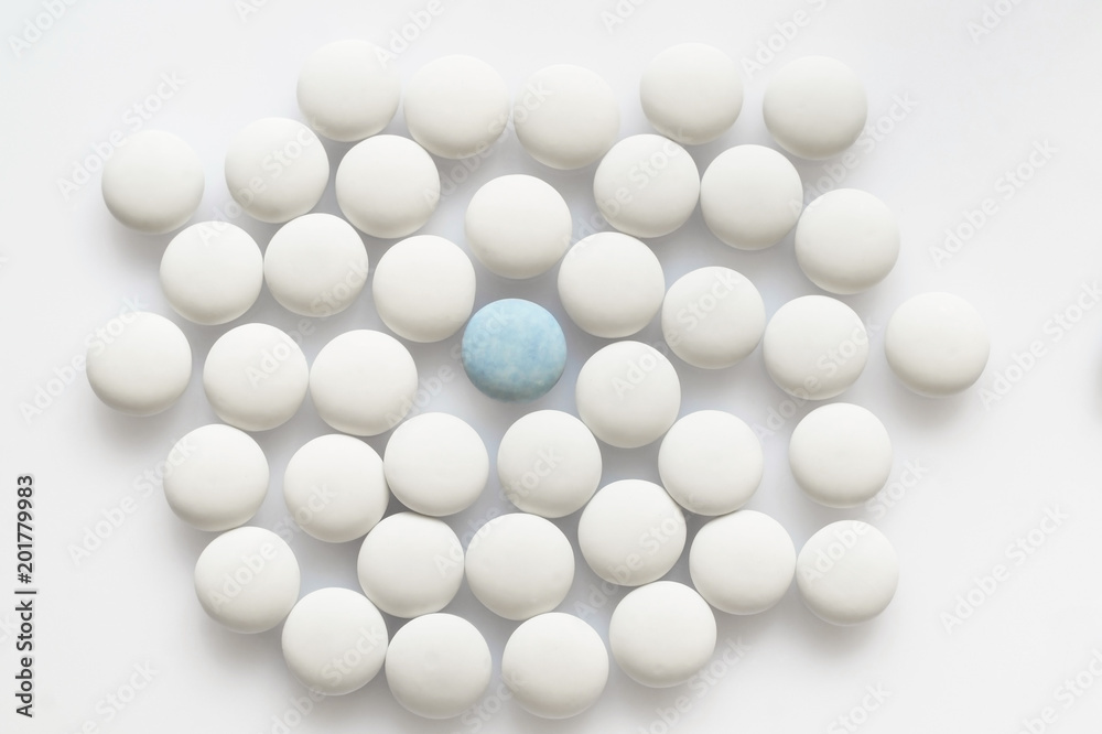 One blue and many white pills