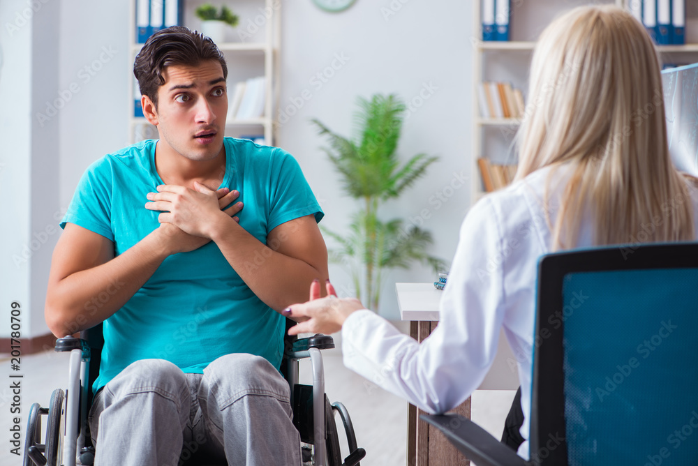 Disabled man in wheel chair visiting woman doctor Disabled man in wheel chair visiting woman doctor