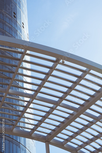 Abstract building. Blue sky and sun reflection
