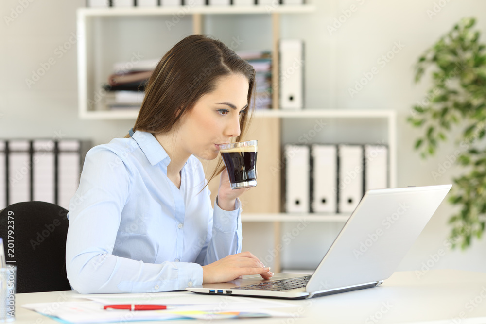 Office worker working and drinking coffee Office worker working and drinking coffee