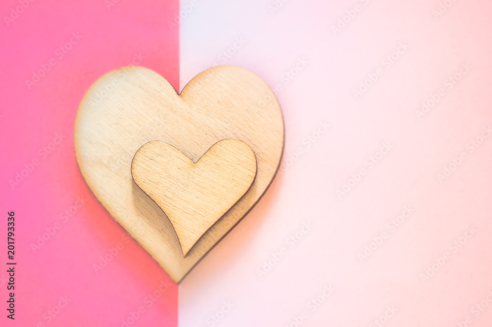 Mother's day background with two wooden hearts and copy space.