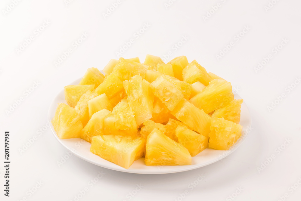 Pineapple slice on white plate on white background. Pineapple slice on white plate on white background.