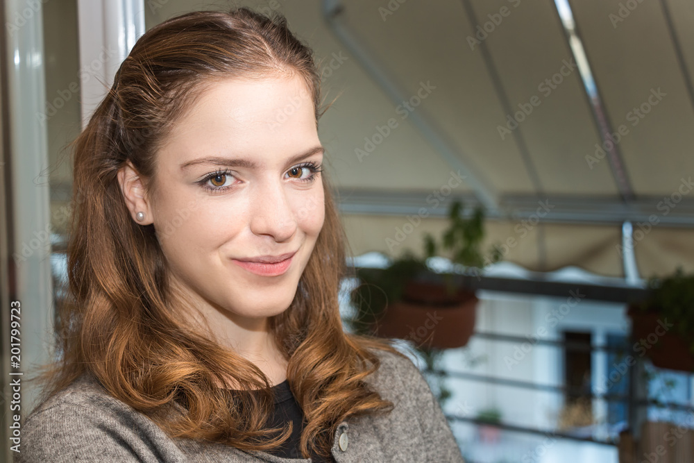 Teenager girl looking at camera, sweet expression. Teenager girl looking at camera, sweet expression.