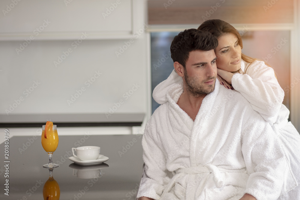 Portrait of a man and his wife in the kitchen while having breakfast Portrait of a man and his wife in the kitchen while having breakfast
