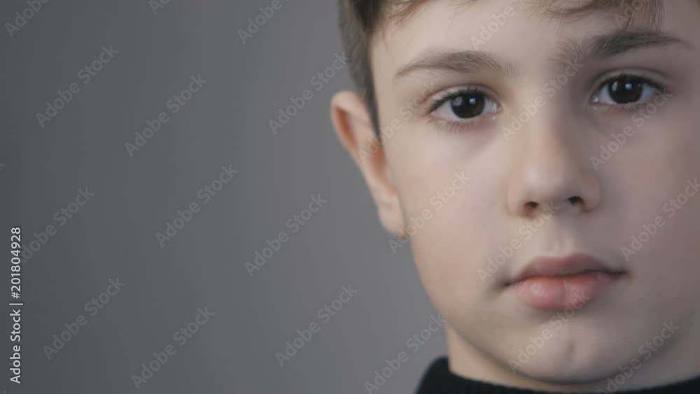 close up portrait of little boy age 10 years looking at camera close up portrait of little boy age 10 years looking at camera