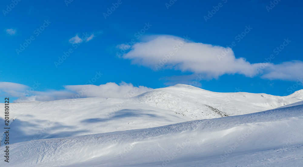 Bright winter scenery in the Alps with fresh snow