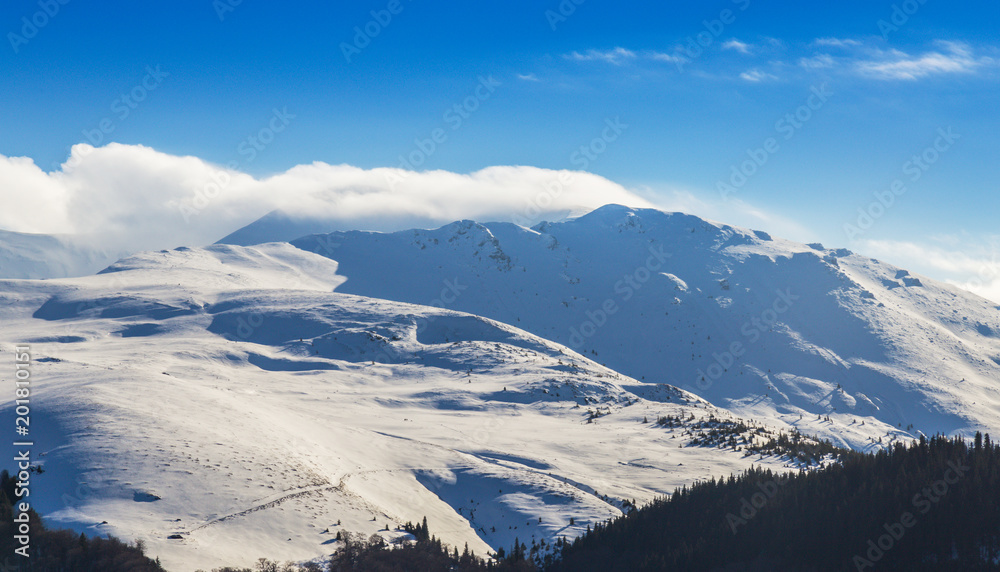 Bright winter scenery in the Alps with fresh snow
