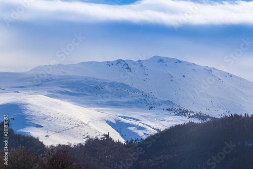 Bright winter scenery in the Alps with fresh snow
