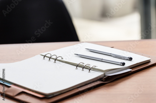 two pen on empty notebook,Selective focus