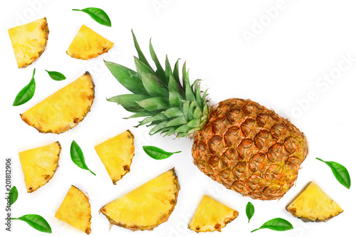 Sliced pineapple decorated with green leaves isolated on white background with copy space for your text Top view