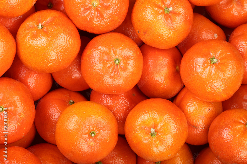 Mandarin, tangerines in the market as a background close-up Mandarin, tangerines in the market as a background close-up