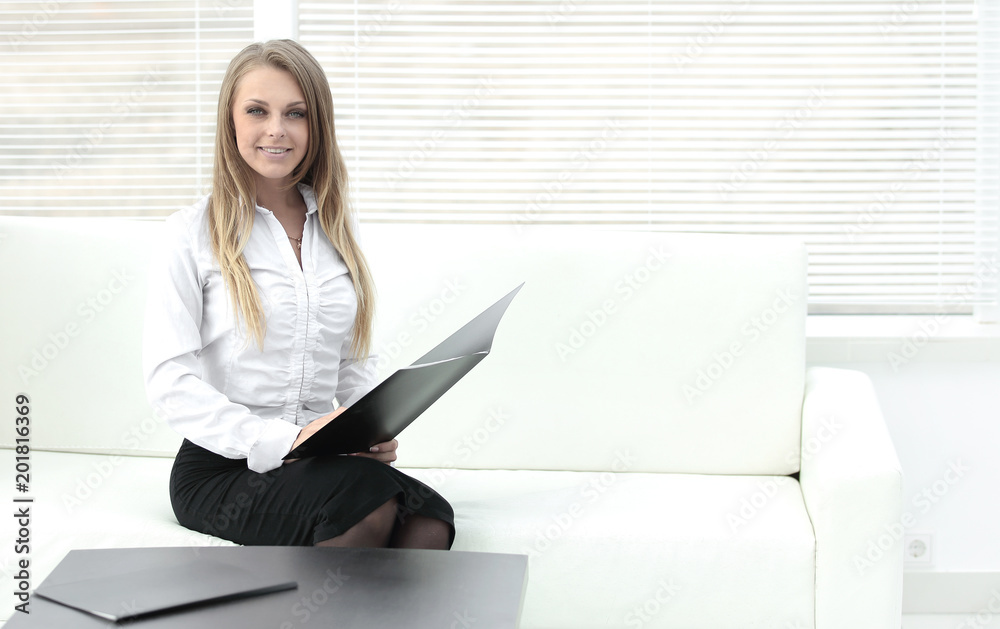 smiling employee clipbord sitting in a modern office smiling employee clipbord sitting in a modern office