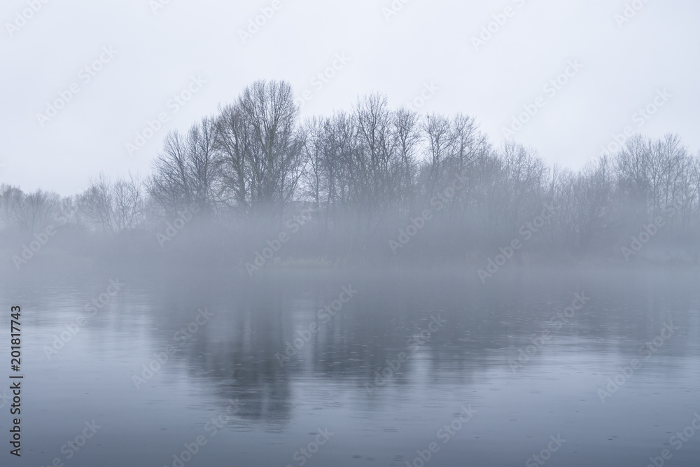 Dramatic background of foggy weather at the lake Dramatic background of foggy weather at the lake
