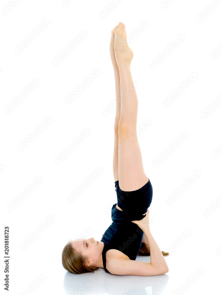 The gymnast perform an acrobatic element on the floor. The gymnast perform an acrobatic element on the floor.