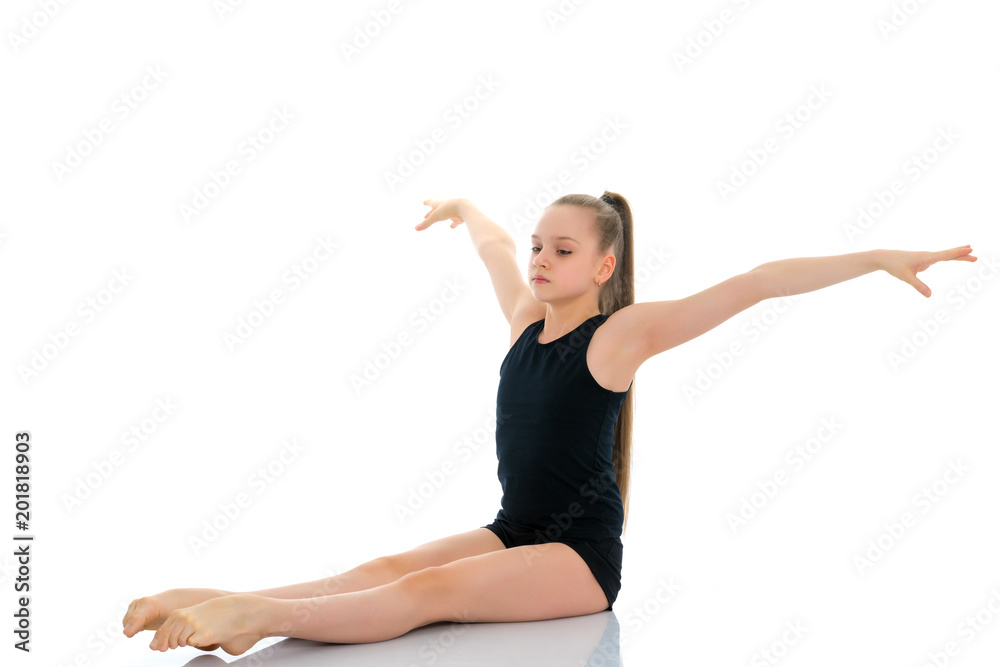 The gymnast perform an acrobatic element on the floor. The gymnast perform an acrobatic element on the floor.