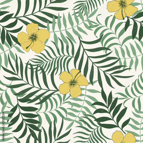 Tropical background with palm leaves and flowers. Seamless floral pattern. Summer vector illustration