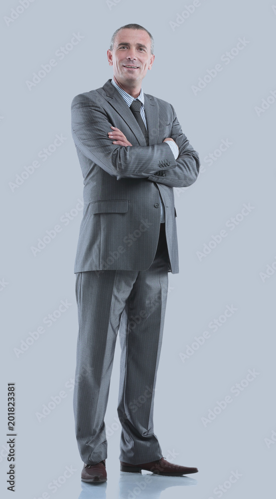 Mature business man arms folded isolated on gray. Mature business man arms folded isolated on gray.
