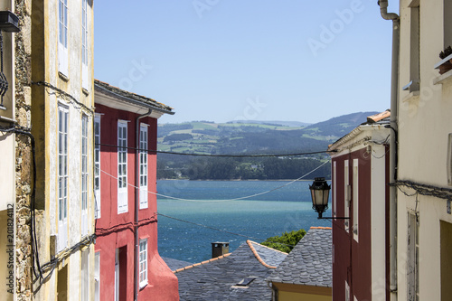 Steep street in the town of Ribadeo, Galicia, Spain, with views to the Eo Estuary and Asturias photo