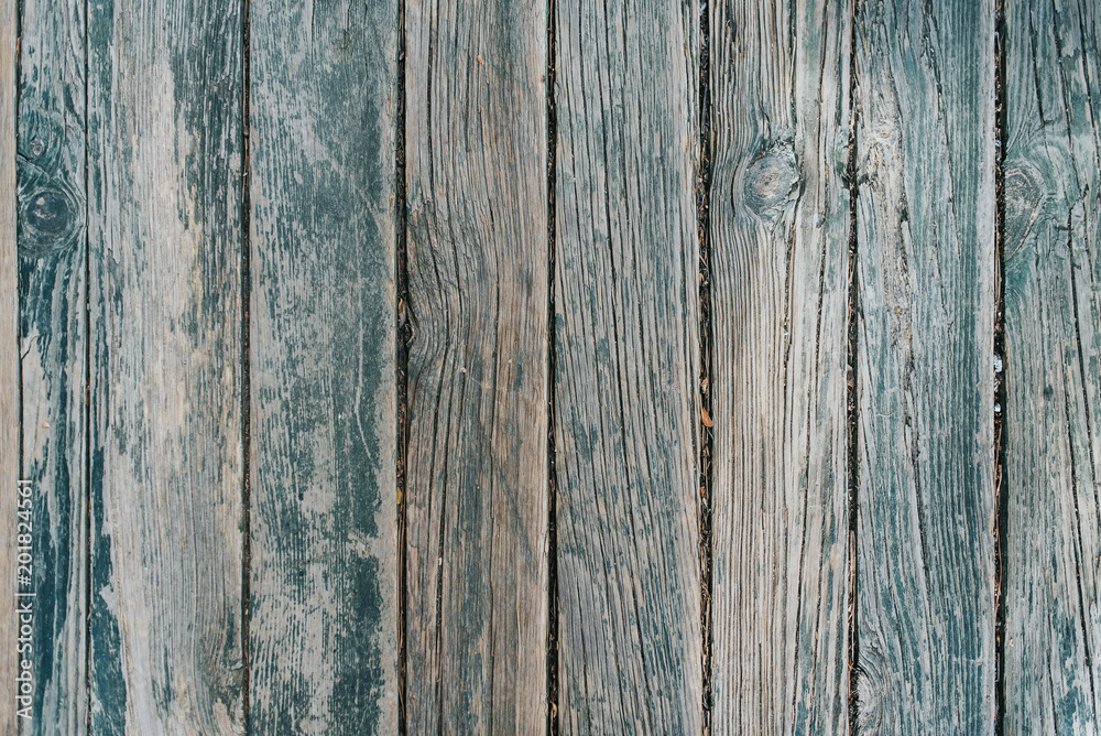 Old wooden barn board with a distressed surface. Old wooden barn board with a distressed surface.