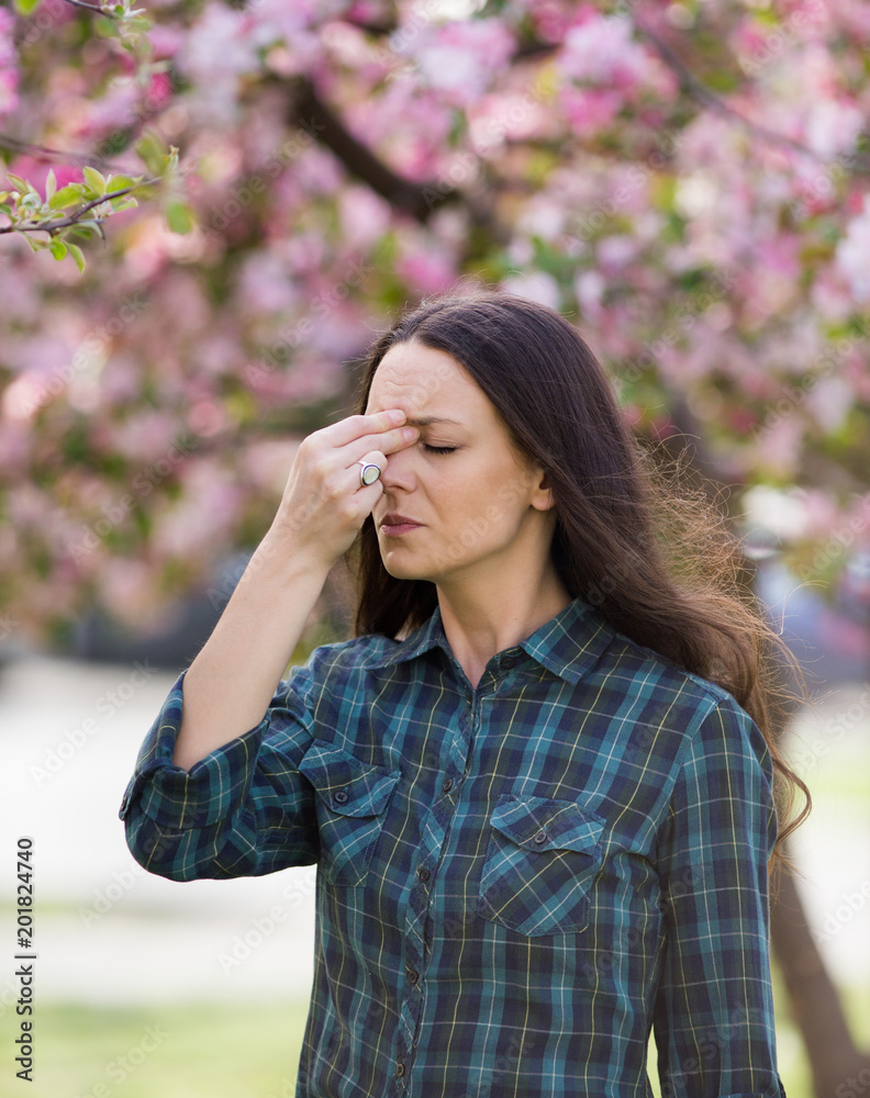 Woman having symptoms of spring pollen allergy Woman having symptoms of spring pollen allergy