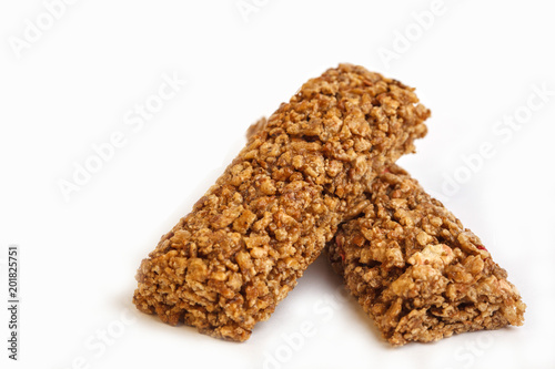 Granola bars isolated on white background. Healthy sweet dessert snack. Cereal granola bar with nuts and berries on white