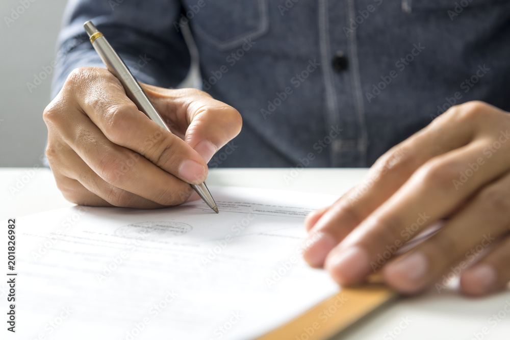 Double Exposure, Young Businessman sign off project document with connection world map background. Business international treaty.