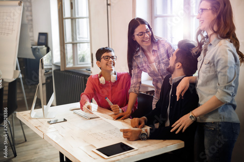 Creative young business people and architects working in office