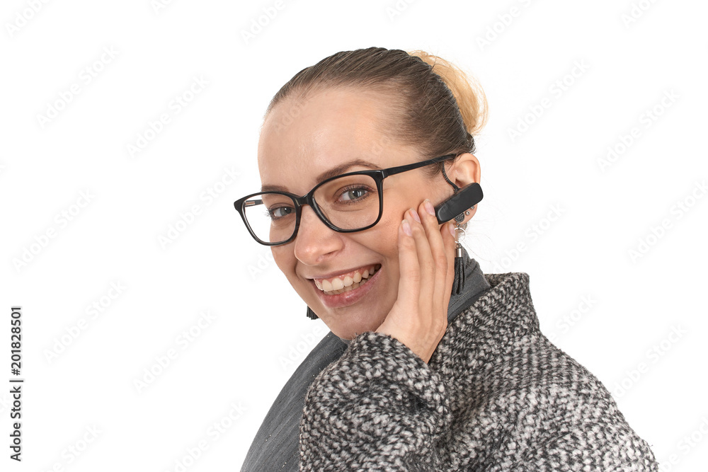 close-up portrait of a girl on a white background with a hands-free handset.