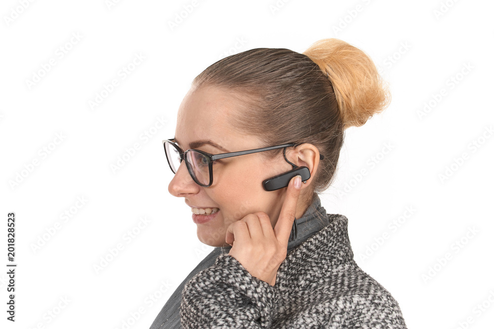 close-up portrait of a girl on a white background with a hands-free handset. close-up portrait of a girl on a white background with a hands-free handset.