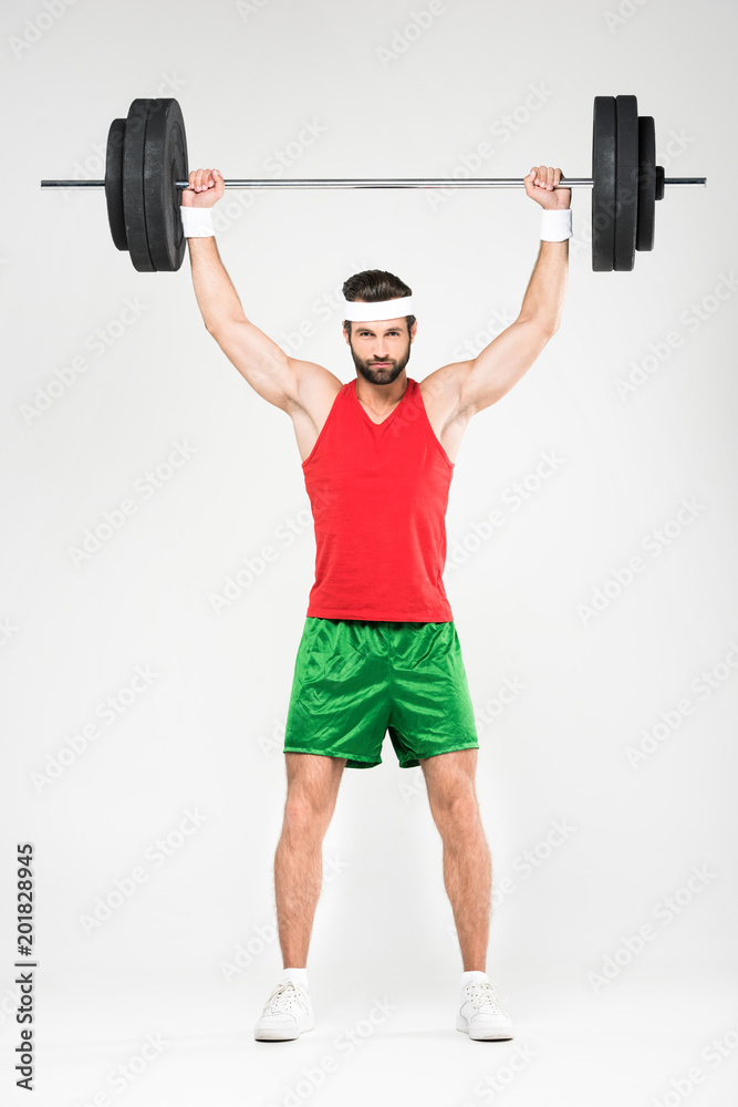 strong sportsman holding barbell, isolated on white strong sportsman holding barbell, isolated on white