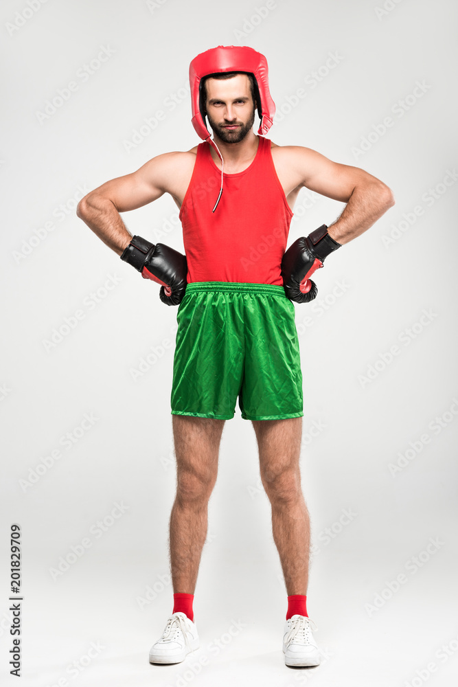sportsman in retro helmet and boxing gloves, isolated on white sportsman in retro helmet and boxing gloves, isolated on white